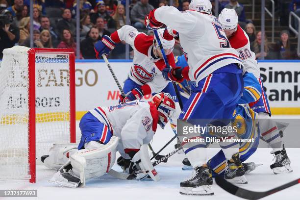 Jake Allen of the Montreal Canadiens makes a save against the St. Louis Blues during the third period at Enterprise Center on December 11, 2021 in St...