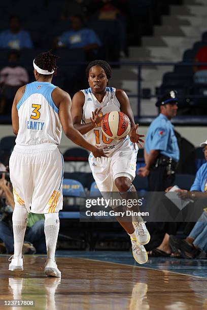 Epiphanny Prince of the Chicago Sky takes a pass from teammate Dominique Canty during the WNBA game against the Indiana Fever on September 4, 2011 at...