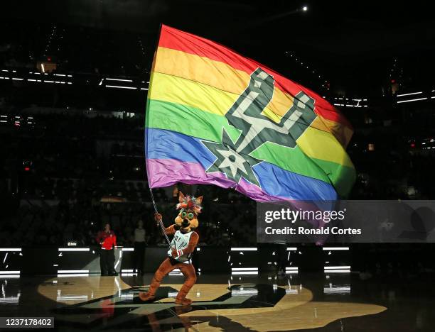 The San Antonio Spurs mascot "Coyote" runs onto the court at the beginning of the game celebrating Pride Night before the start of their game against...