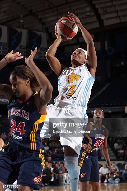 Dominique Canty of the Chicago Sky goes to the basket over Tamika Catchings of the Indiana Fever during the WNBA game on September 4, 2011 at the...