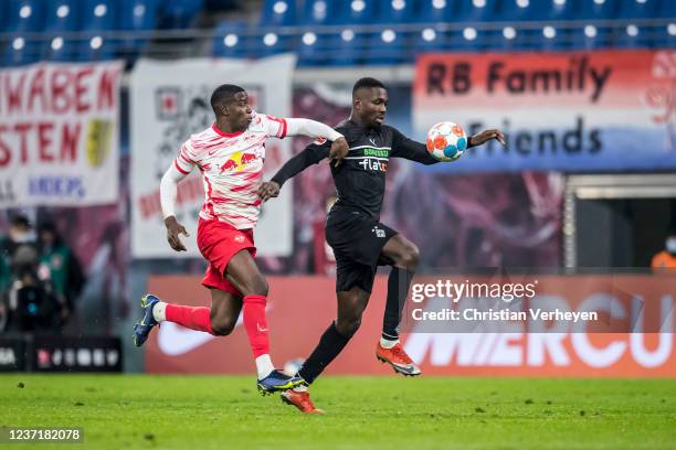 Marcus Thuram of Borussia Moenchengladbach and Nordi Mukiele of Leipzig in action during the Bundesliga match between RB Leipzig and Borussia...