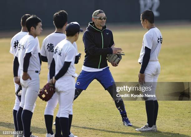 Former Seattle Mariners outfielder Ichiro Suzuki coaches Takamatsu Shogyo high school baseball players as a temporary instructor on Dec. 12 in the...