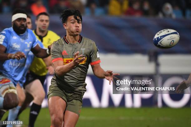 Harlequins' English fly-half Marcus Smith passes the ball during the European Rugby Champions Cup first round day pool B rugby union match between...