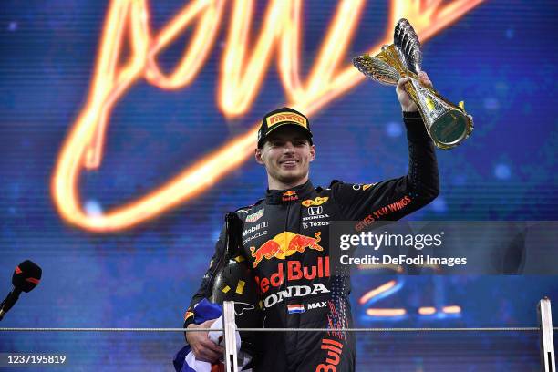 World Champion Max Verstappen , Red Bull Racing Honda with the trophy after the F1 Grand Prix of Abu Dhabi at Yas Marina Circuit on December 12, 2021...