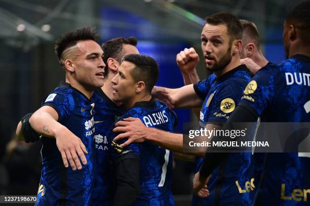 Inter Milan's Argentine forward Lautaro Martinez celebrates after with teammates after scoring his team's first goal during the Italian Serie A...