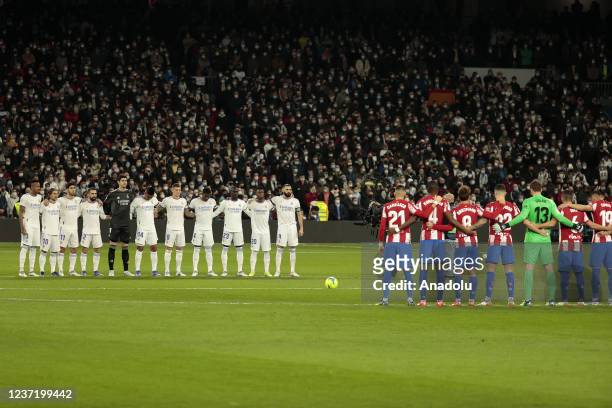 Players of two teams stand in silent to pay respect to Spanish tennis player Manuel Santana died aged 83 ahead of La Liga soccer match between Real...