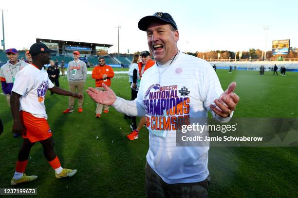 Players dump water on Head Coach Mike Noonan of the Clemson Tigers after defeating the Washington Huskies during the Division I Mens Soccer...