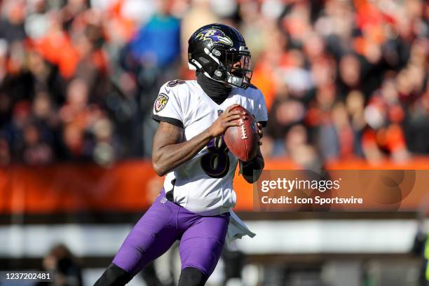 Baltimore Ravens quarterback Lamar Jackson looks to pass during the first quarter of the National Football League game between the Baltimore Ravens...