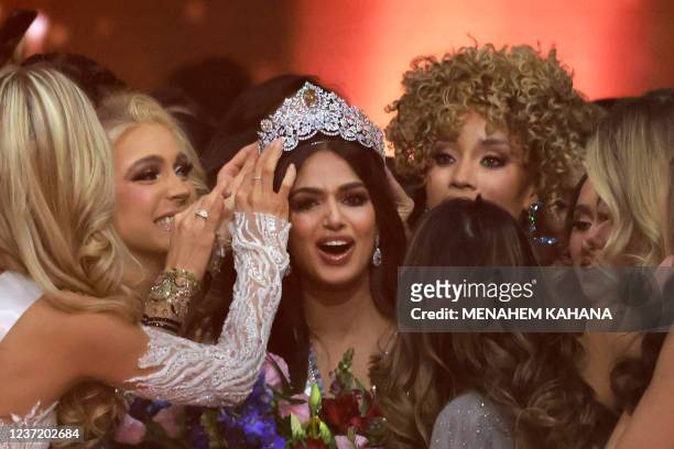 Miss Universe contestants congratulate Miss India, Harnaaz Sandhu , as she is crowned Miss Universe during the 70th Miss Universe beauty pageant in...