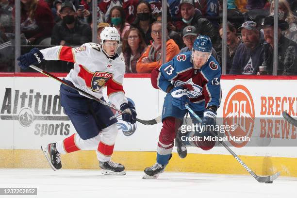Valeri Nichushkin of the Colorado Avalanche skates against Eetu Luostarinen of the Florida Panthers at Ball Arena on December 12, 2021 in Denver,...