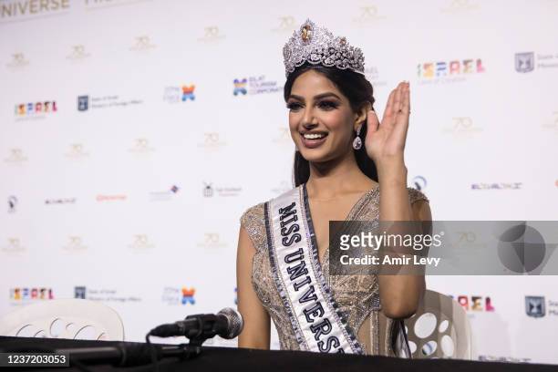 The new Miss Univerese Harnaaz Sandhu from India greets the press before speaking during a press conference after the 70th Miss Universe Competition...