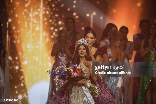 December 2021, Israel, Eilat: Harnaaz Sandhu reacts to being crowned Miss Universe during the 70th "Miss Universe" beauty pageant in Israel's...