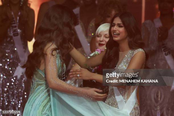 Miss Paraguay, Nadia Ferreira prepares to embrace Miss India, Harnaaz Sandhu as Miss India is announced winner of the 70th Miss Universe beauty...