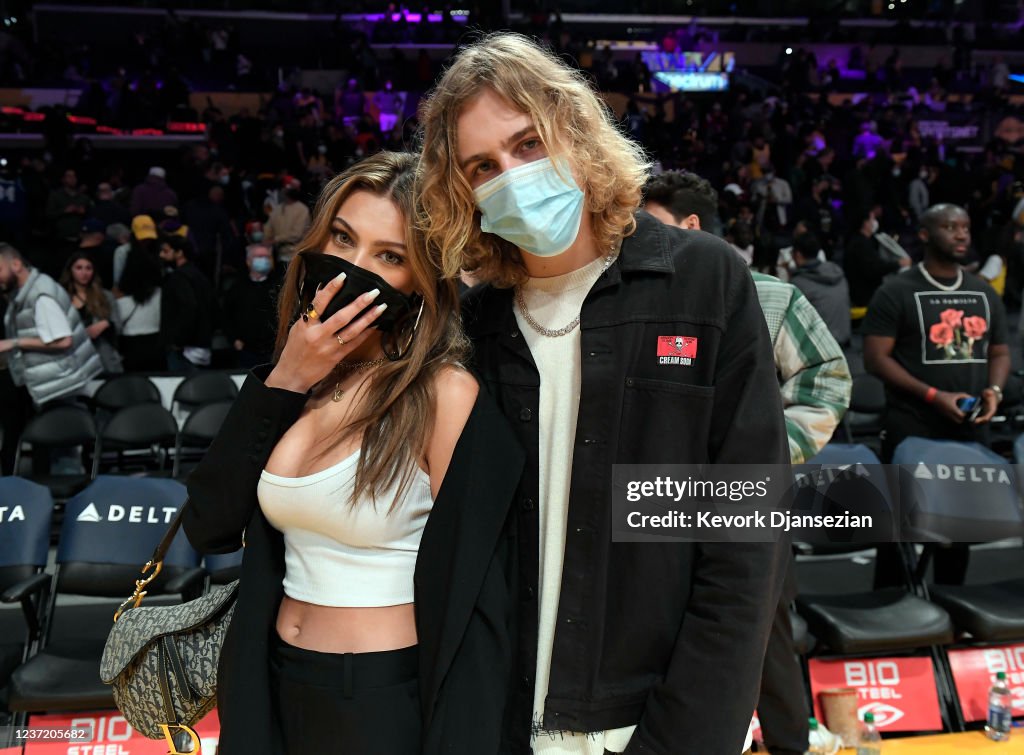 The Kid Laroi and his girlfriend Katarina Deme attend the game... News