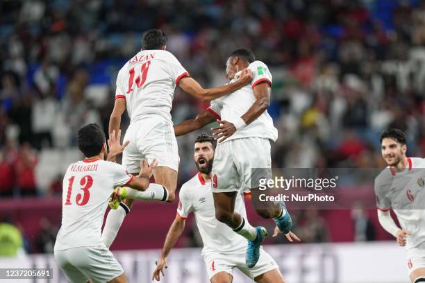 Of Jordan team celebrate with teammate after score first goal during the FIFA Arab Cup Qatar 2021 Quarter-Final match between Egypt and Jordan at Al...