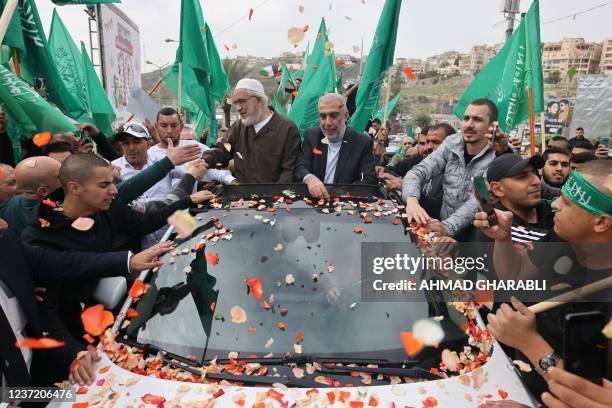 Sheikh Raed Salah , leader of the radical northern branch of the Islamic Movement in Israel, celebrates with supporters following his release from a...