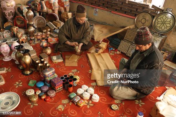 Kashmiri artisans packing Christmas ornaments ahead of Christmas celebrations in Srinagar,Kashmir on December 13 , 2021.The artisans say that the...