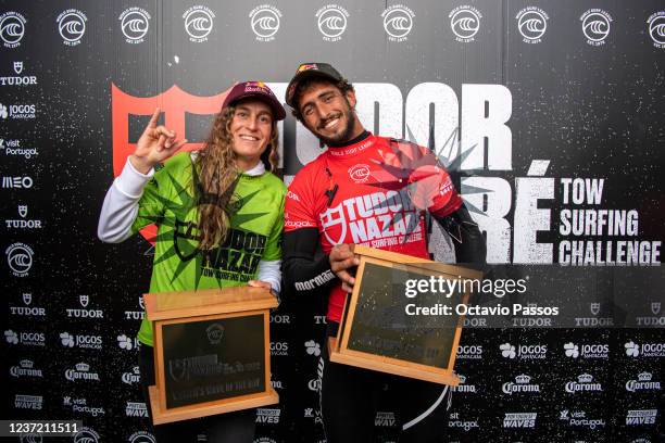 Big wave surfers Justine Dupont from France and Lucas Chianca Chumbo from Brazil pose for a picture with their prizes followed the TUDOR Nazare Tow...