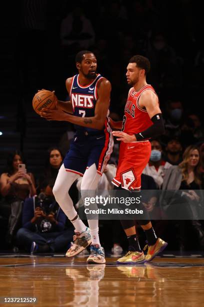 Zach LaVine of the Chicago Bulls in action against Kevin Durant of the Brooklyn Nets at Barclays Center on December 04, 2021 in New York City. NOTE...