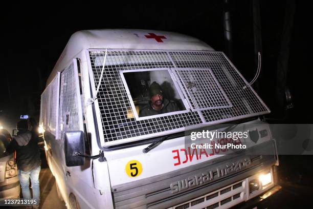 Indian paramilitary ambulance arrives at the spot after suspected militants attacked a bus carrying policemen in the Khrew area of Srinagar, Indian...