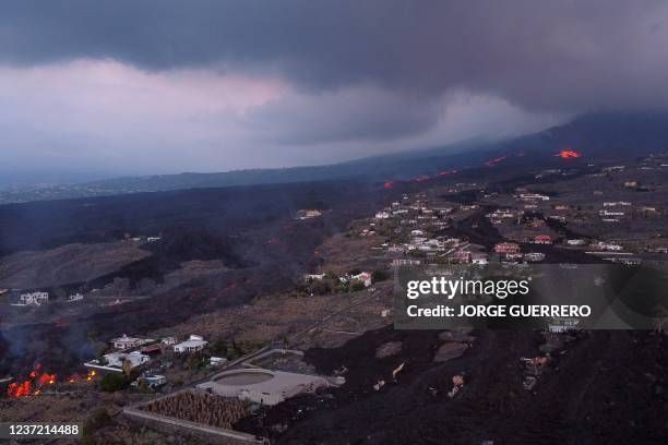 This aerial picture shows the lava flow and houses covered with lava following the eruption of the Cumbre Vieja volcano, in Las Norias, on the Canary...