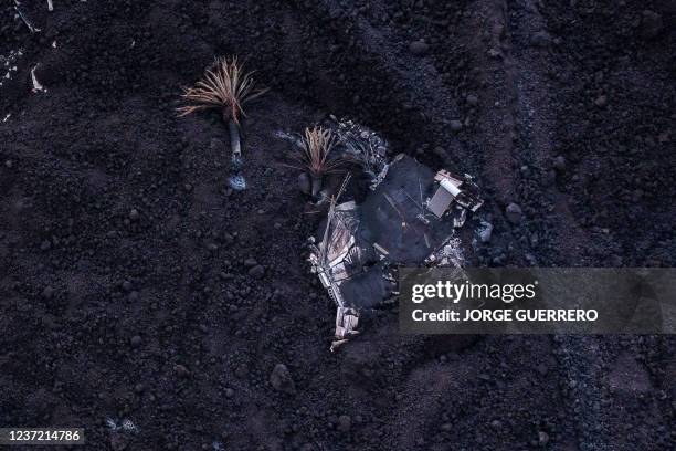 This aerial picture shows houses covered with lava following the eruption of the Cumbre Vieja volcano, in Las Norias, on the Canary Island of La...