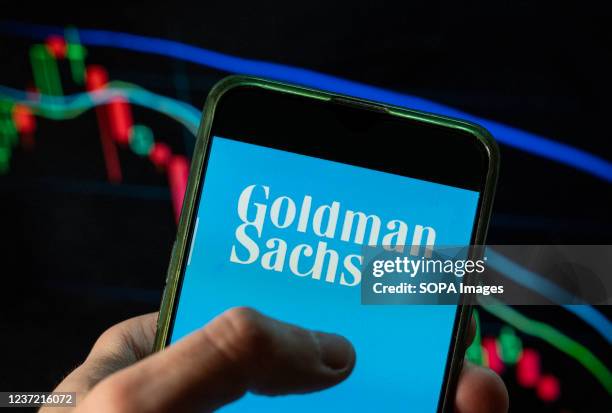 In this photo illustration the American multinational investment bank and financial services company Goldman Sachs logo seen displayed on a...