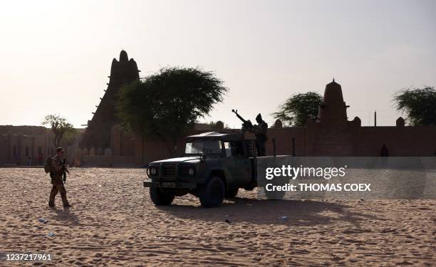 French soldiers of the Barkhane force patrol the streets of Timbuktu, northern Mali, on December 5, 2021. France's anti-jihadist military force in...