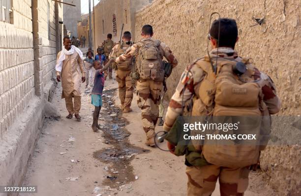 French soldiers of the Barkhane force patrol the streets of Timbuktu, northern Mali, on December 5, 2021. France's anti-jihadist military force in...