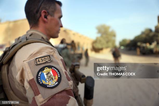 French soldiers of the Barkhane force patrol the streets of Timbuktu, northern Mali, on December 5, 2021. France's anti-jihadist military force in...