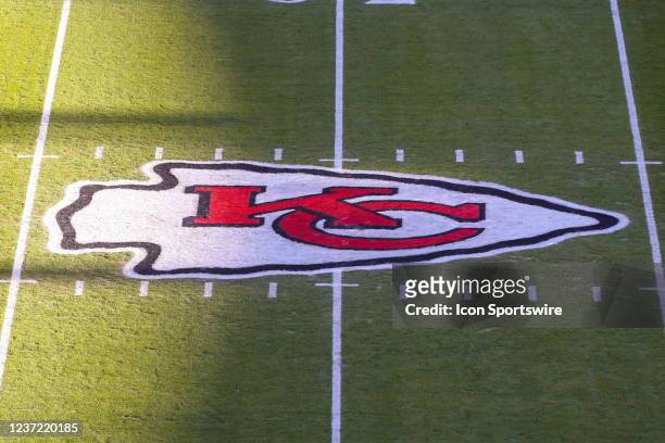Shadows cross over the Kansas City Chiefs arrowhead logo at midfield before an NFL game with the Las Vegas Raiders on Dec 12, 2021 at GEHA Field at...