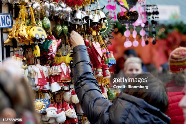 Shopper views ornaments for sale at the Urbanspace Union Square Holiday Market in New York, U.S., on Sunday, Dec. 12, 2021. The U.S. Census Bureau is...