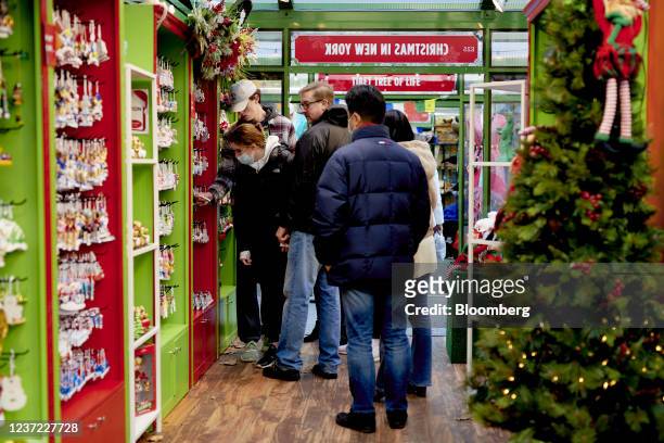 Shoppers view ornaments for sale at the Urbanspace Holiday Shops at Bryant Park in New York, U.S., on Sunday, Dec. 12, 2021. The U.S. Census Bureau...