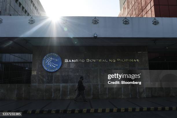 Pedestrian outside the Bangko Sentral ng Pilipinas headquarters complex in Manila, the Philippines, on Tuesday, Dec. 14, 2021. The Philippines...