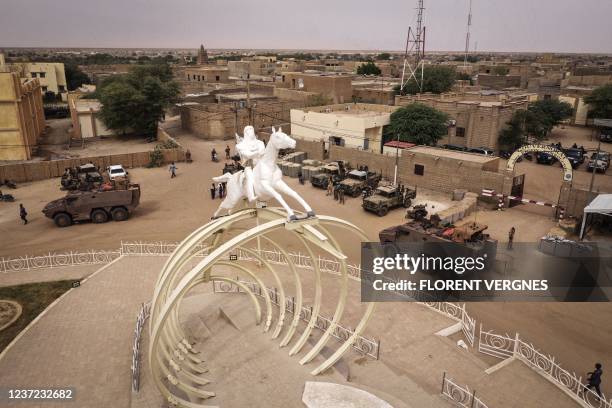 This aerial view taken on December 14, 2021 shows French Barkhane forces during their last patrol in Timbuktu's Independence Square, before the...