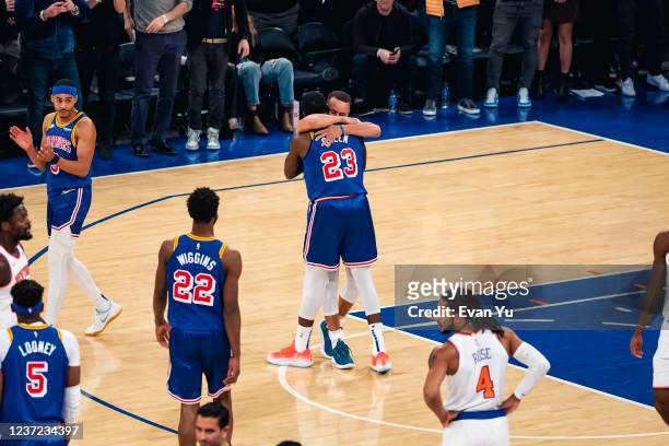 Stephen Curry of the Golden State Warriors hugs Draymond Green of the Golden State Warriors after passing Ray Allen for most three pointers made in...