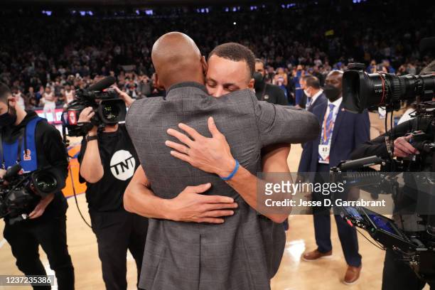 Legend, Ray Allen and Stephen Curry of the Golden State Warriors hug after passing Ray Allen for most three pointers made in NBA history with 2,974...