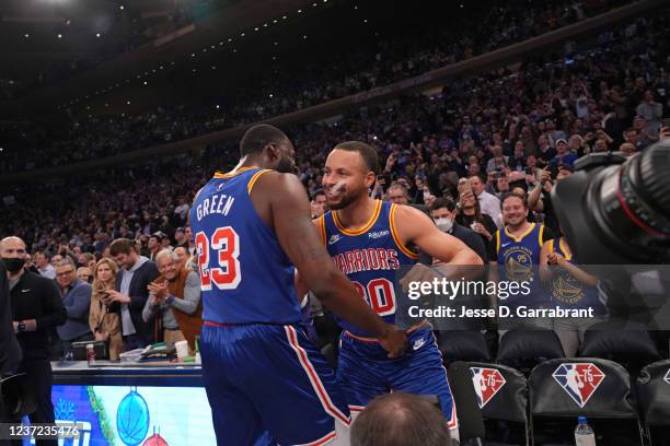 Draymond Green of the Golden State Warriors and Stephen Curry of the Golden State Warriors celebrate after passing Ray Allen for most three pointers...