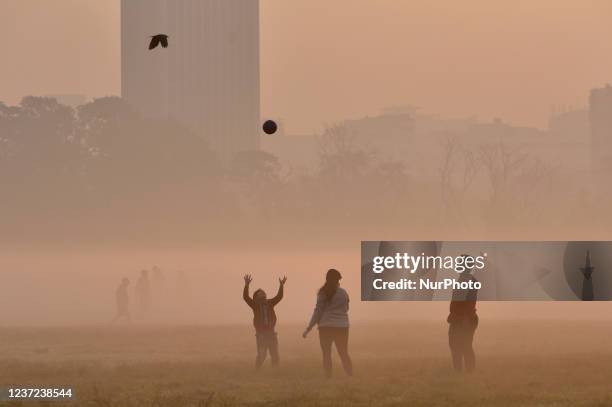 Child plays with a ball through the dense smog in Kolkata, India, 15 December, 2021. Today's AQI level in Kolkata is 278. Indo-Gangetic plain cities,...