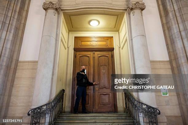 Judicial officer stands in front of a courtroom in Berlin where the trial took place on December 15, 2021 against a Russian defendant accused of...