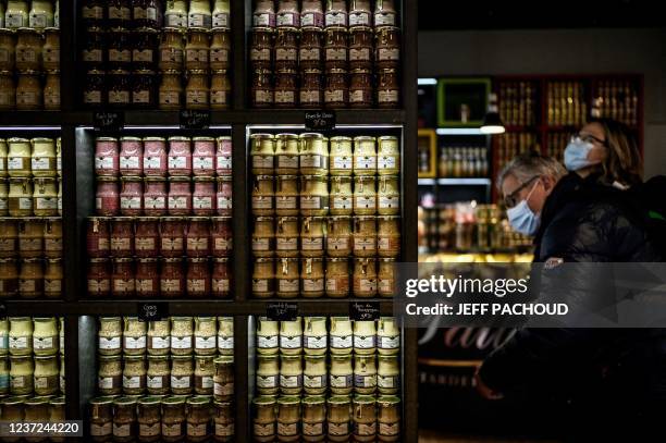 Customers shop at the Fallot mustard shop in Dijon on December 14, 2021.