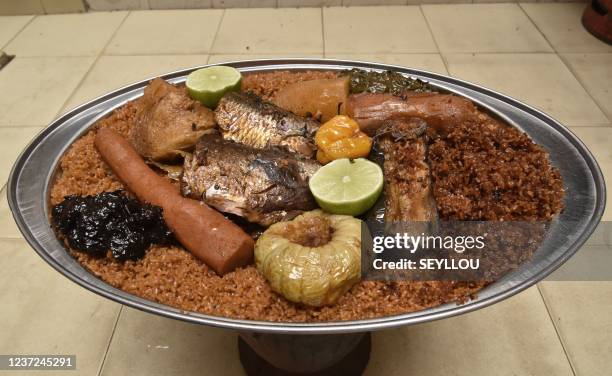 Ceebu jën, a traditional dish made of rice, fish and a variety of vegetables is photographed in a house in the Parcelles Assainies in Dakar on...