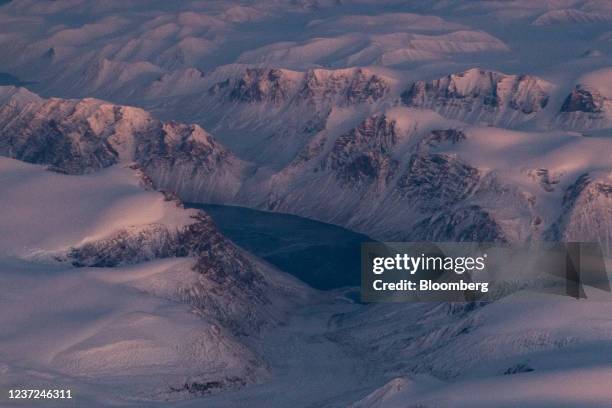 The Arctic tundra from the window of an airplane heading from Iqaluit to Pond Inlet, Nunavut, Canada, on Wednesday, Nov. 10, 2021. The Earth's poles...