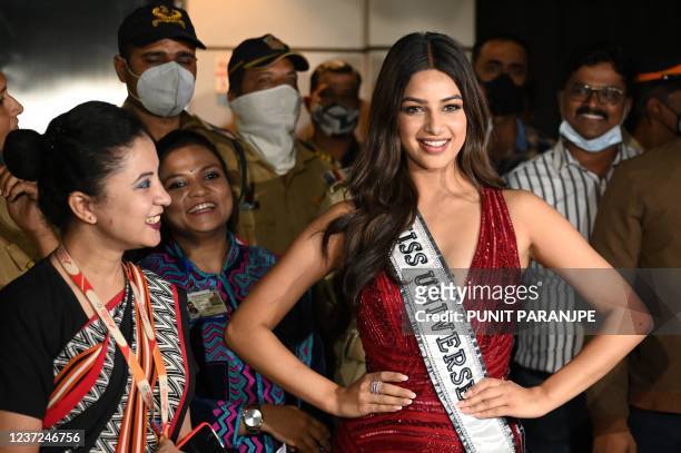 Miss Universe 2021 Harnaaz Sandhu , winner of the 70th Miss Universe beauty pageant, poses for pictures after arriving at the International airport...