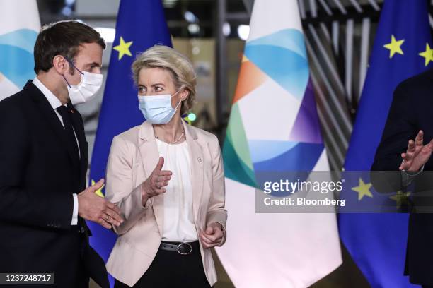 Emmanuel Macron, France's president, left, and Ursula von der Leyen, president of the European Commission, prior to a family photo on the sidelines...