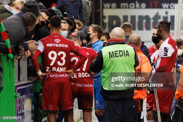 Essevee's players talking to the Essevee's supporters after losing a soccer match between SV Zulte Waregem and Royale Union Saint-Gilloise, Wednesday...