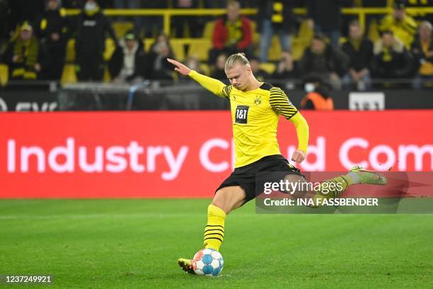 Dortmund's Norwegian forward Erling Braut Haaland kicks the ball to score a penalty 1-0 goal during the German first division Bundesliga football...
