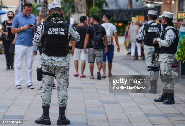 Members of the National Guard patrol the 5th Avenue in Playa Del Carmen . According to security reports three recent military attacks on Mexico's top...