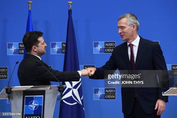 Secretary General Jens Stoltenberg greets Ukrainian President Volodymyr Zelensky during a press conference after their bilateral meeting at the...