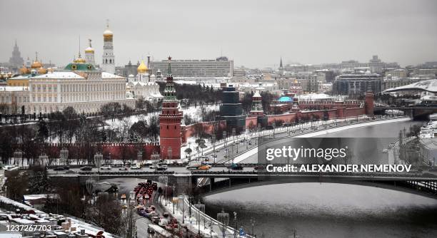 View of the Kremlin taken in downtown Moscow on the bank of the Moskva river on December 16, 2021.